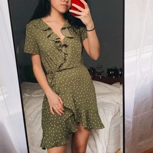 Green polka dotted wrap dress